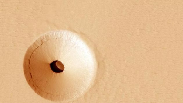 Mars' Mysterious Hole: Clues to Hidden Worlds and Ancient Life