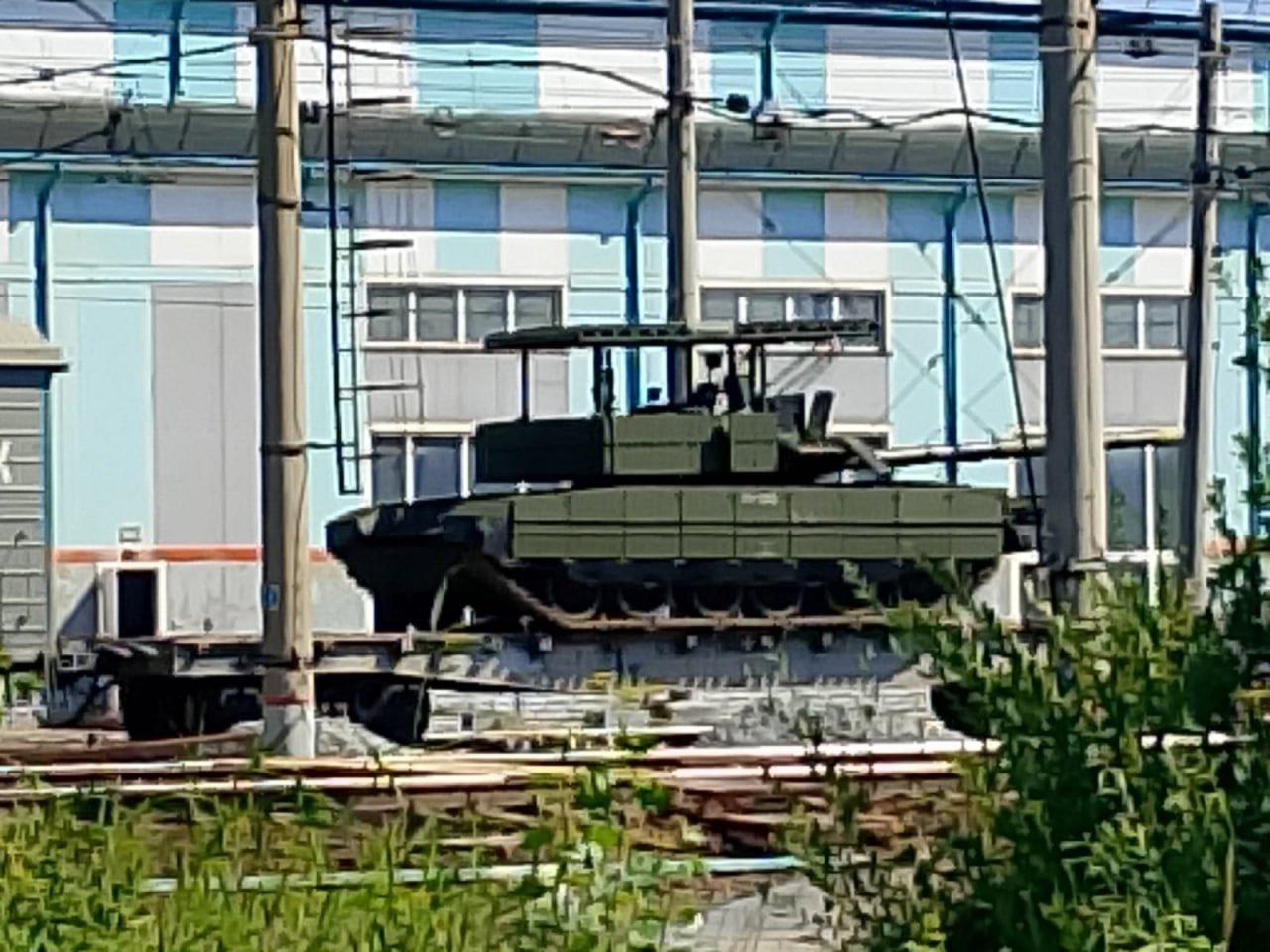 Upgraded Russian T-80BVM Tank With Enhanced Anti-Drone Protection Spotted on Rail Transport
